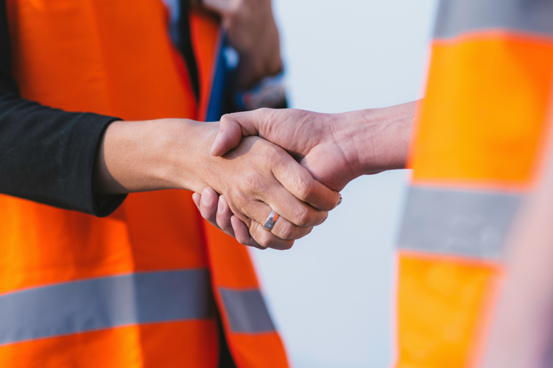 Construction workers handshake